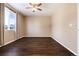 Simple bedroom with dark hardwood floors and window at 3564 S Jebel Cir, Aurora, CO 80013