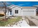 Gray house with two-car garage, and a small front yard at 3564 S Jebel Cir, Aurora, CO 80013