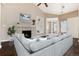 Living room with fireplace, built-in shelves, and sectional sofa at 3564 S Jebel Cir, Aurora, CO 80013