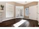 Living room with fireplace, built-in shelves, and dark hardwood floors at 3564 S Jebel Cir, Aurora, CO 80013