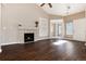 Living room with fireplace, built-in shelves, and hardwood floors at 3564 S Jebel Cir, Aurora, CO 80013