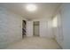 Cozy bedroom with wallpaper, carpet, a window and closet at 3000 S Newland St, Denver, CO 80227