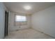Simple bedroom with neutral carpet, window, and closet at 3000 S Newland St, Denver, CO 80227