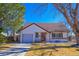 Charming home featuring a well-kept lawn, and a single-car garage at 3000 S Newland St, Denver, CO 80227