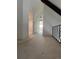 Second floor hallway featuring neutral carpet and staircase with wrought iron railing at 3000 S Newland St, Denver, CO 80227