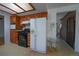 Traditional kitchen featuring wooden cabinetry and black appliances at 3000 S Newland St, Denver, CO 80227