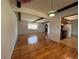 Bright living room showcasing hardwood floors and exposed ceiling beams at 3000 S Newland St, Denver, CO 80227