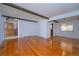 Bright living room showcasing hardwood floors and exposed ceiling beams at 3000 S Newland St, Denver, CO 80227