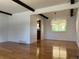 Bright living room showcasing hardwood floors and exposed ceiling beams at 3000 S Newland St, Denver, CO 80227