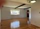 Bright living room showcasing hardwood floors and exposed ceiling beams at 3000 S Newland St, Denver, CO 80227