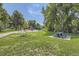 Community playground with swings, a slide, and a picnic area for Gathering fun in a green space at 3000 S Newland St, Denver, CO 80227