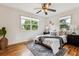 Cozy bedroom with hardwood floors, natural light, and stylish furnishings, creating a relaxing retreat at 4912 Indiana St, Golden, CO 80403