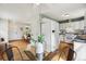 Eat-in kitchen with a glass table, white appliances, and easy access to the rest of the home at 4912 Indiana St, Golden, CO 80403
