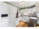 Well-lit kitchen featuring modern appliances, white cabinetry, and sleek countertops, perfect for cooking at 4912 Indiana St, Golden, CO 80403