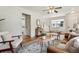 Open-concept living room with hardwood floors, neutral decor, and ample seating, ideal for entertaining at 4912 Indiana St, Golden, CO 80403