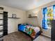 A bedroom with a small bed and a window at 1273 S Zeno Way # A, Aurora, CO 80017