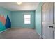 Bright bedroom with a mountain mural, a window with natural light, and a closet at 6472 N Dunkirk Ct, Aurora, CO 80019