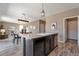 Bright kitchen with stainless steel dishwasher, connecting seamlessly to the dining and living areas, promoting an open concept design at 6472 N Dunkirk Ct, Aurora, CO 80019