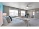 Main bedroom features a walk-in closet and sunny windows, enhancing the appeal of this spacious retreat at 6472 N Dunkirk Ct, Aurora, CO 80019