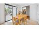 Bright dining area features a sliding glass door to a private patio and an adjacent staircase at 1254 S Yosemite Way # 99, Denver, CO 80247