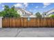 View of the complex featuring a wooden fence at 1254 S Yosemite Way # 99, Denver, CO 80247