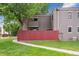 Exterior shot of the home, showing a fenced yard and walkway at 1254 S Yosemite Way # 99, Denver, CO 80247
