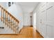 Entry hallway with a wooden staircase and hardwood floors at 1254 S Yosemite Way # 99, Denver, CO 80247