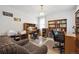 Home office featuring chandelier, built-in bookshelves and multiple workspaces at 1254 S Yosemite Way # 99, Denver, CO 80247