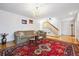 Inviting living room featuring hardwood floors, chandelier, and a comfortable seating arrangement at 1254 S Yosemite Way # 99, Denver, CO 80247