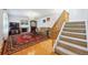 Bright living room with hardwood floors, a fireplace, and a staircase leading to the upper level at 1254 S Yosemite Way # 99, Denver, CO 80247
