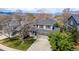 Beautiful home in a serene neighborhood boasts lush landscaping, mature trees, and a welcoming front porch at 1041 Riddlewood Rd, Highlands Ranch, CO 80129