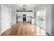 Open kitchen featuring white cabinets, stainless steel appliances, and sliding glass door to outdoor deck at 1041 Riddlewood Rd, Highlands Ranch, CO 80129