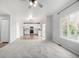 Open floor plan featuring the living room, kitchen, and dining area at 1041 Riddlewood Rd, Highlands Ranch, CO 80129