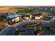 Aerial view of modern community center featuring a pool, playground, and well-designed buildings within a residential neighborhood at 188 S Waterloo St, Aurora, CO 80018
