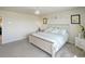 Cozy bedroom with a queen size bed, soft carpet, and moon-themed decor at 188 S Waterloo St, Aurora, CO 80018