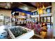 Inviting clubhouse features a game room, bar, and comfortable seating for socializing and entertainment at 188 S Waterloo St, Aurora, CO 80018