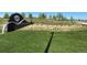 Community entrance features a stylish Harmony sign, manicured lawns, and landscaping, creating an inviting welcome at 188 S Waterloo St, Aurora, CO 80018