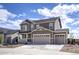 Two-story home showcasing a spacious three-car garage, covered porch, and modern architectural details at 188 S Waterloo St, Aurora, CO 80018