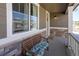 Inviting front porch with bench seating and stone accents. Perfect for relaxing at 188 S Waterloo St, Aurora, CO 80018