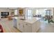 Open-concept kitchen with large island, stainless steel appliances, and modern finishes at 188 S Waterloo St, Aurora, CO 80018