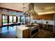Spacious kitchen with modern stainless steel appliances, island, and stylish lighting for cooking and dining at 188 S Waterloo St, Aurora, CO 80018
