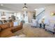 Open concept living space with kitchen and staircase featuring modern furnishings and decor at 188 S Waterloo St, Aurora, CO 80018