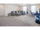 Spacious living room with comfortable seating and large windows providing ample natural light at 188 S Waterloo St, Aurora, CO 80018