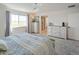 Spacious main bedroom with large windows, dresser, and ensuite bathroom at 188 S Waterloo St, Aurora, CO 80018