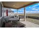Inviting covered patio features outdoor seating and expansive views of the surrounding landscape at 188 S Waterloo St, Aurora, CO 80018