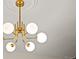 Modern gold chandelier with white globe shades at 3050 N Gaylord St, Denver, CO 80205