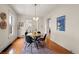 Elegant dining room featuring a glass-top table and dark chairs at 3050 N Gaylord St, Denver, CO 80205