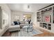 Bright living room with comfortable seating and built-in shelving at 3050 N Gaylord St, Denver, CO 80205