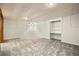 Spacious basement area with carpet and built-in shelving at 6300 W Mansfield Ave # 61, Denver, CO 80235
