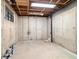 Unfinished basement offering potential for customization and additional living space with concrete walls and ceiling at 6300 W Mansfield Ave # 61, Denver, CO 80235